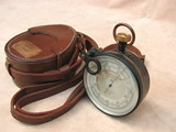 E R Watts & Son surveying aneroid barometer with leather case.